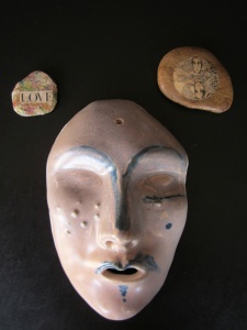 mask and stones